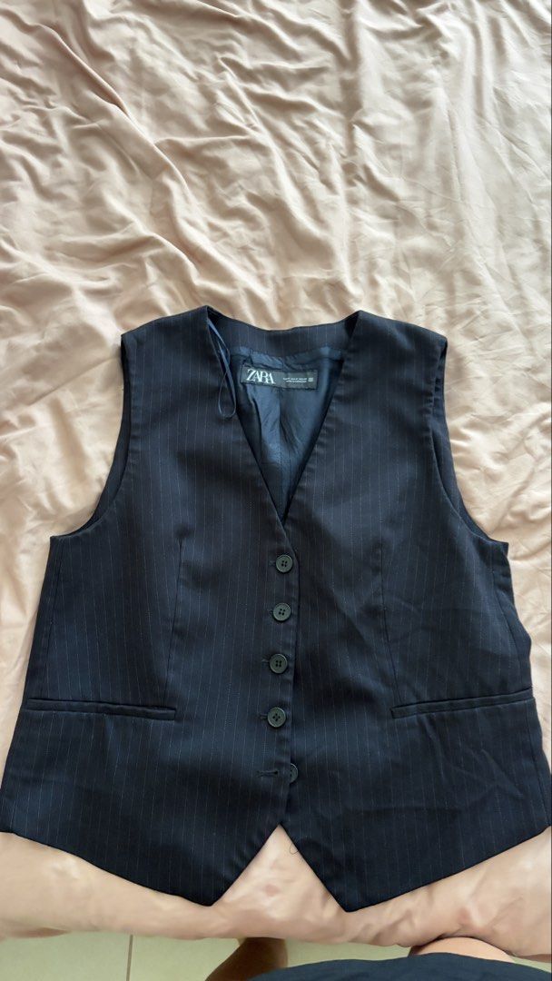 Zara Pinstripe Vest (Category: Sleeveless) located in Taguig. Submitted by ellezzzzz (Listing ID 1462695513, Image 1). Description: - Classic Zara pinstripe vest - V-neckline with button closure - Two functional front pockets - Fully lined for a polished look - Ideal for layering over shirts or dresses - Measurements available in photos.