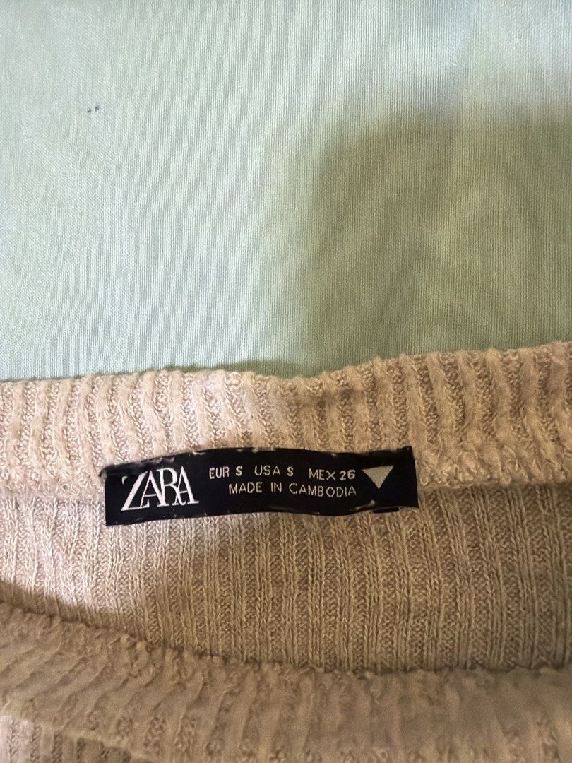Zara Ribbed Long Sleeve Top (Category: Longsleeves) located in Quezon City. Submitted by cynlchan (Listing ID 1462692864, Image 2). Description: - Zara grey ribbed long sleeve top - Size: S - Unique asymmetrical hem with long flowing panels - Crew neck - Made in Cambodia.