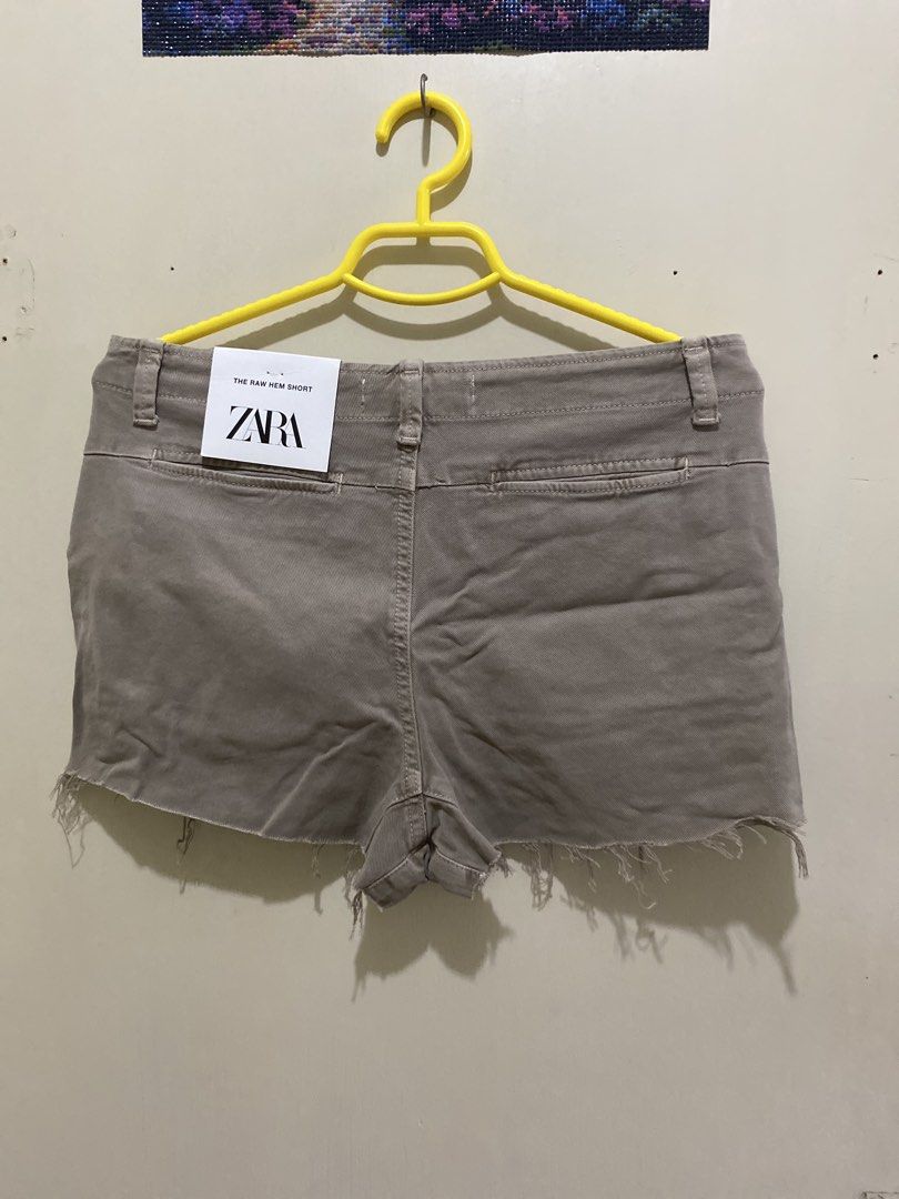 ZARA The Raw Hem Short Size S (Category: Shorts) located in Pasig City. Submitted by alaineeeee (Listing ID 1462771957, Image 3). Description: - Brand: Zara - Style: Shorts - Color: Light brown/taupe - Size: S - Features: Raw hem detail - Origin: Made in Turkey - Occasion: Perfect for casual wear.