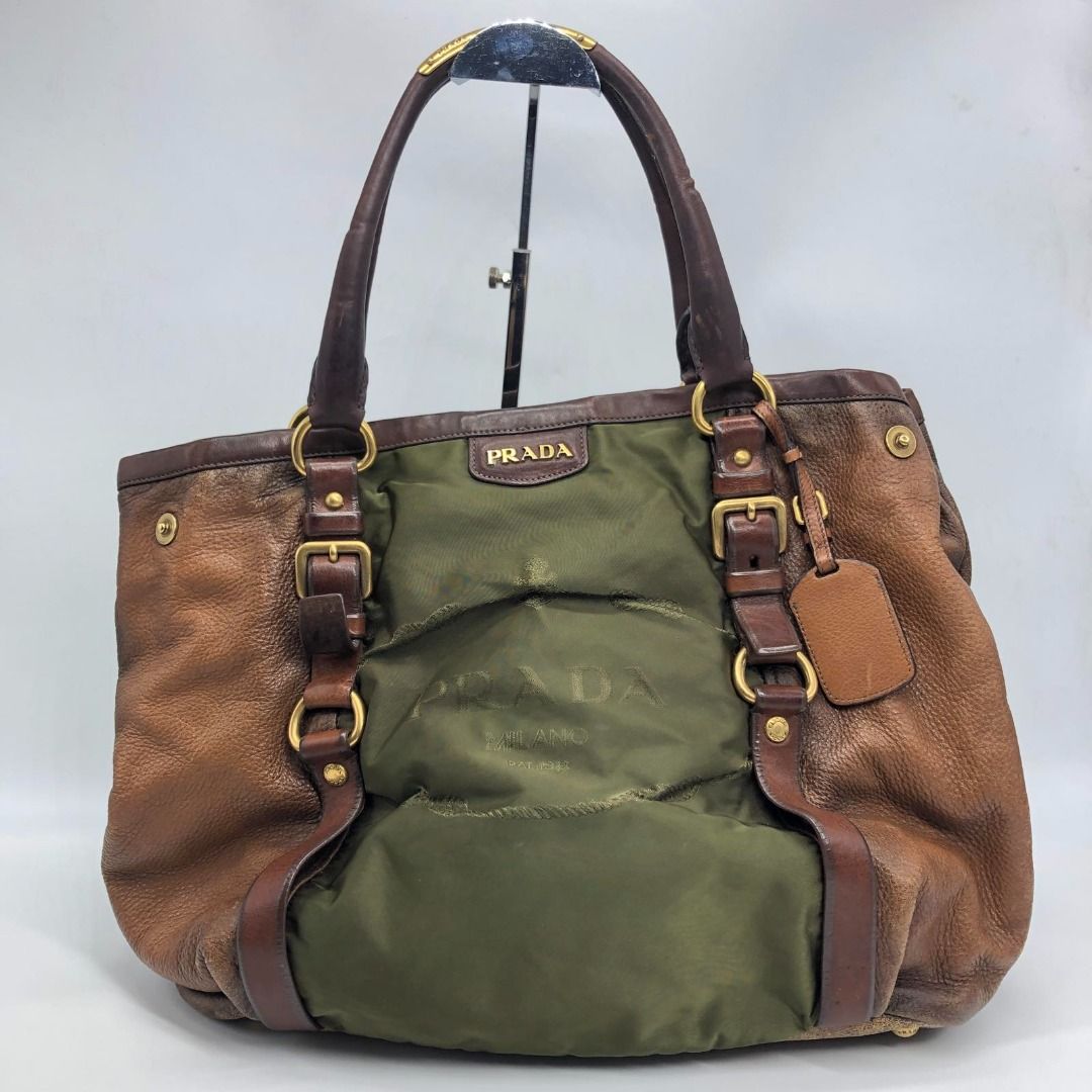267007985 PRADA BAG LEATHER NYLON LEATHER TOTE (Category: Luxury Bags & Wallets) located in Taguig. Submitted by ecoring.ph (Listing ID 1456618758, Image 1). Description: ◆CONDITION: B- ◆DESCRIPTIONS: (Other defects/info:) OUTER: The nylon body of the bag is stained, dirty, and shows signs of use. The leather body of the bag is scratched, scuffed, stained, dirty, wrinkled, discolored, deformed, has press marks, and shows signs of use. The bottom 