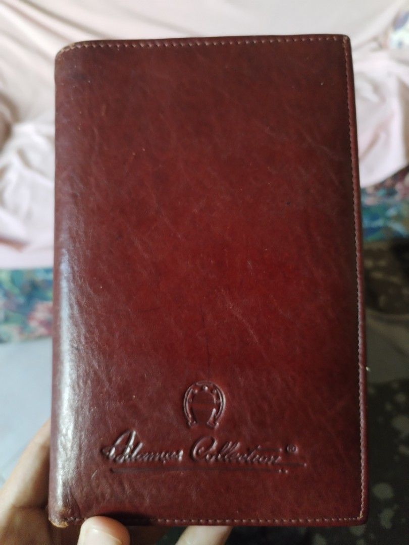 Adamas Collection Leather Wallet (Category: Luxury Bags & Wallets) located in Caloocan City. Submitted by keenocean_367cde (Listing ID 1459167092, Image 1). Description: - Genuine Aigner brown leather wallet - Ample card slots for organization - Includes a secure zippered compartment.