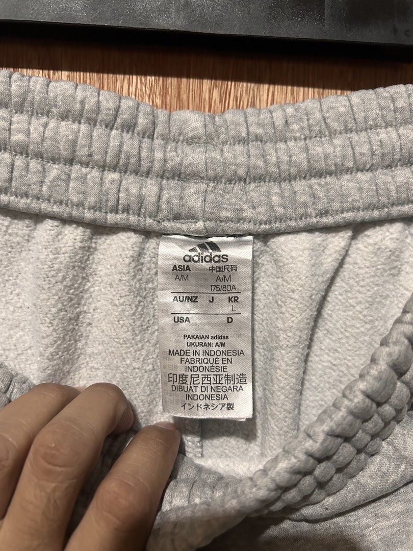 Adidas Essentials French Terry Sweat Pants (Category: Joggers) located in Cabiao. Submitted by alldaythrift (Listing ID 1459146640, Image 3). Description: - Grey Adidas sweatpants - Classic Adidas logo on left leg - Elastic waistband with drawstring - Made in Indonesia - Size L - Ideal for lounging or workouts Adidas Essentials French Terry Sweat Pants Size Large Waistline 28-34 Length 39.5 Excellent condition Minimal stains 570 .