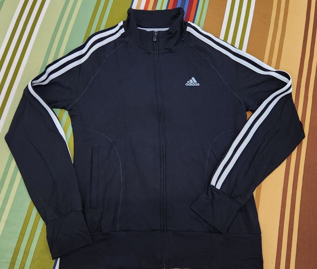 Adidas Track Jacket Black White Stripes Size L (Category: Coats, Jackets and Outerwear) located in Manila. Submitted by happybear_77e59e777 (Listing ID 1459204696, Image 2). Description: - Black Adidas track jacket - Classic white stripes on sleeves - Full zip closure - Front pockets - Size L - Ideal for sports or casual wear.