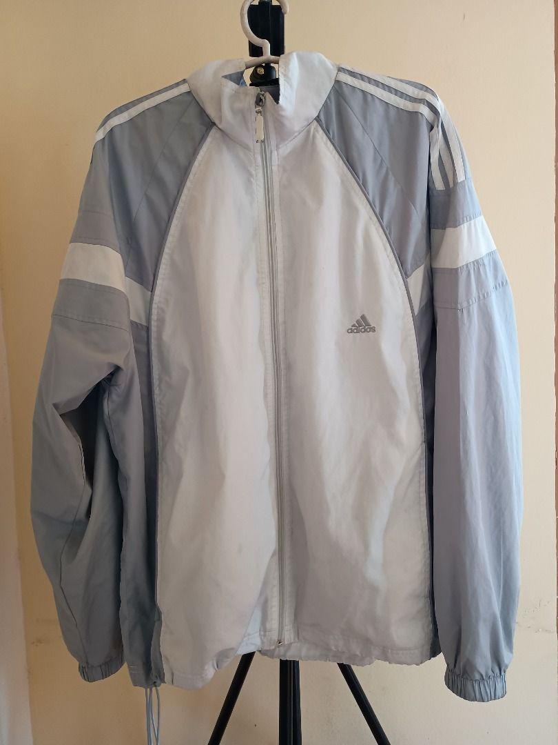 Adidas Track Jacket Windbreaker (Category: Activewear) located in Teresa. Submitted by baratolang234 (Listing ID 1459097031, Image 1). Description: - Adidas track jacket - Original - Iconic three stripes on sleeves - Grey and white colorblocked design - Full zip closure - Windbreaker - Ideal for casual wear or sports may bakbak lang sa zipper but in good condition can fit medium to large body Mit up nearby or Pick up By lalamove.