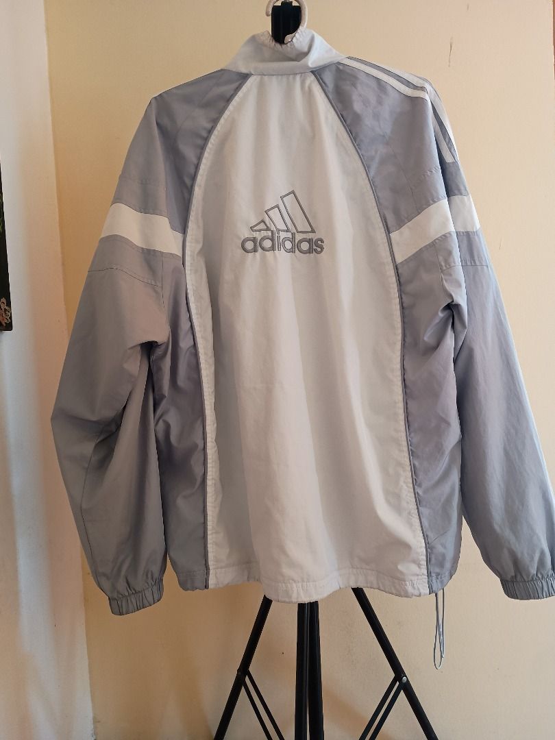 Adidas Track Jacket Windbreaker (Category: Activewear) located in Teresa. Submitted by baratolang234 (Listing ID 1459097031, Image 2). Description: - Adidas track jacket - Original - Iconic three stripes on sleeves - Grey and white colorblocked design - Full zip closure - Windbreaker - Ideal for casual wear or sports may bakbak lang sa zipper but in good condition can fit medium to large body Mit up nearby or Pick up By lalamove.