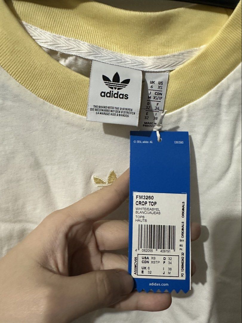 Adidas White Crop Top (Category: Shirts) located in Manila. Submitted by shopkriscloset (Listing ID 1459254092, Image 2). Description: Rfs: too small ‼️PLEASE READ BEFORE PLACING AN OFFER: 🩵Please be patient and respectful. 🤗 If I don’t get to reply immediately, I might be working. 🧡Please REFRAIN from making an offer if you do not intend to complete the purchase‼️ 🧡Kindly read the description for more details on shipping and the product itse