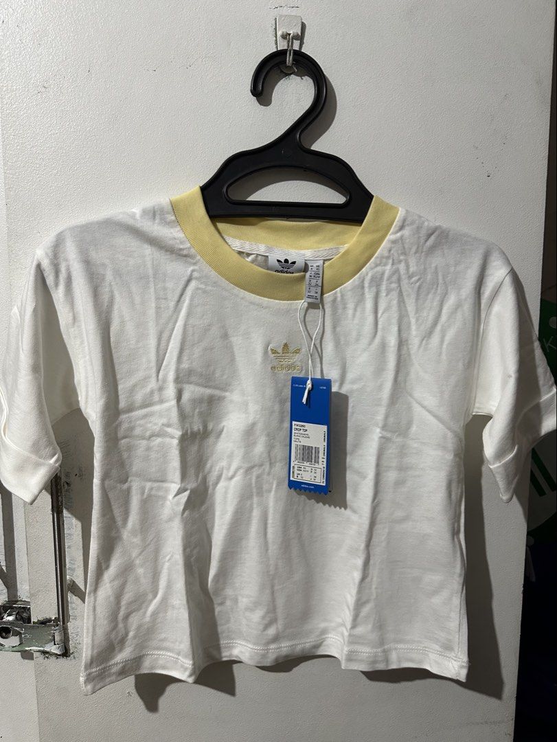 Adidas White Crop Top (Category: Shirts) located in Manila. Submitted by shopkriscloset (Listing ID 1459254092, Image 1). Description: Rfs: too small ‼️PLEASE READ BEFORE PLACING AN OFFER: 🩵Please be patient and respectful. 🤗 If I don’t get to reply immediately, I might be working. 🧡Please REFRAIN from making an offer if you do not intend to complete the purchase‼️ 🧡Kindly read the description for more details on shipping and the product itse