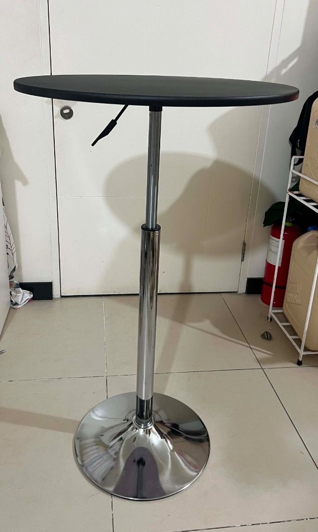 Adjustable Height Round Top Bar Table (Category: Tables & Sets) located in Mandaluyong City. Submitted by lovedbyjaaaam (Listing ID 1459260656, Image 3). Description: - Adjustable height bar table - Round chrome base - Black tabletop - Ideal for small spaces or as a standing desk - Easy to move around.