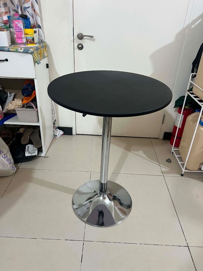 Adjustable Height Round Top Bar Table (Category: Tables & Sets) located in Mandaluyong City. Submitted by lovedbyjaaaam (Listing ID 1459260656, Image 1). Description: - Adjustable height bar table - Round chrome base - Black tabletop - Ideal for small spaces or as a standing desk - Easy to move around.