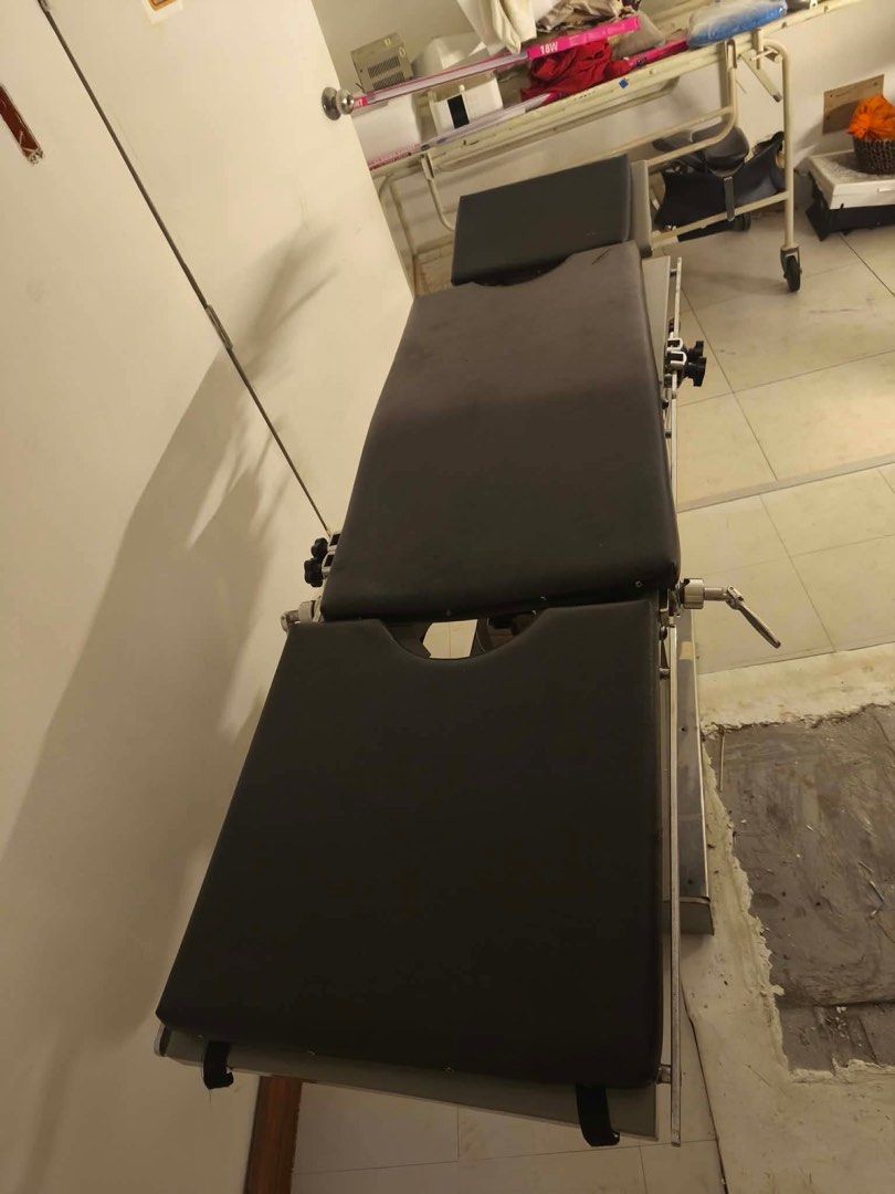 Adjustable Operating Table for Medical Use (Category: Medical Supplies & Tools) located in Marikina City. Submitted by yanee.yv (Listing ID 1459161150, Image 3). Description: - Adjustable operating table - Padded surface with convenient cutouts - Height and position easily adjusted with levers and foot pedal - Perfect for various medical procedures.