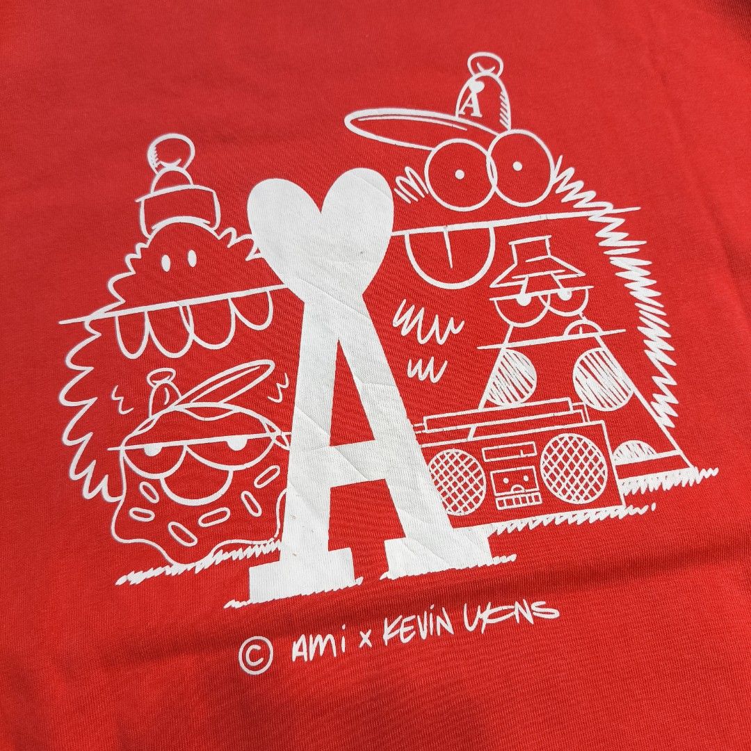 Ami X Kevin Lyons Graphic Shirt (Category: Tshirts & Polo Shirts ) located in Manila. Submitted by shykes_26 (Listing ID 1459094190, Image 3). Description: Dimensions Width - 25 Length - 30 Size on tag - L Issues - Minimal hairlines.
