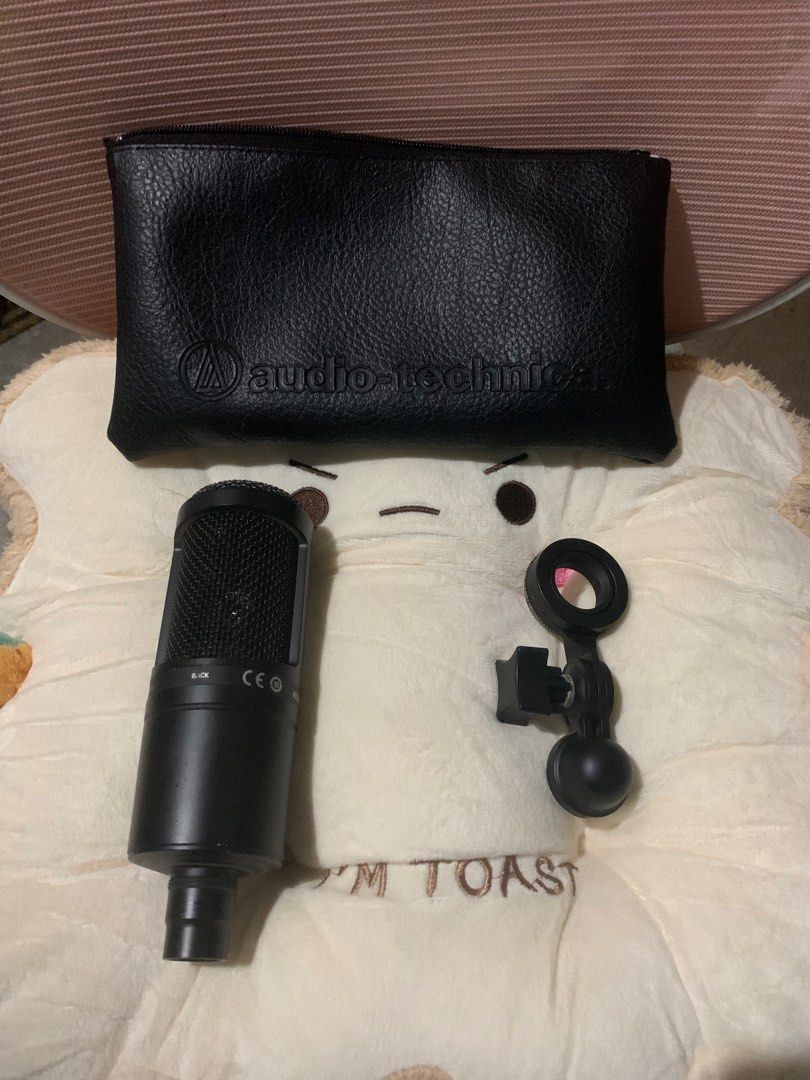 Audio Technica AT2020 Condenser Microphone (Category: Microphones) located in Bacolod City. Submitted by kvnsvge (Listing ID 1459161217, Image 2). Description: - Black microphone with textured grille - Ideal for recording and podcasting - Includes a faux leather pouch with zipper closure - Easy to carry around.