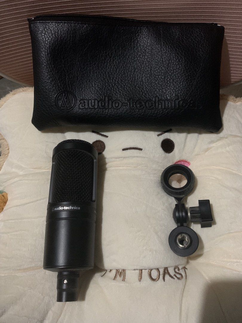 Audio Technica AT2020 Condenser Microphone (Category: Microphones) located in Bacolod City. Submitted by kvnsvge (Listing ID 1459161217, Image 1). Description: - Black microphone with textured grille - Ideal for recording and podcasting - Includes a faux leather pouch with zipper closure - Easy to carry around.