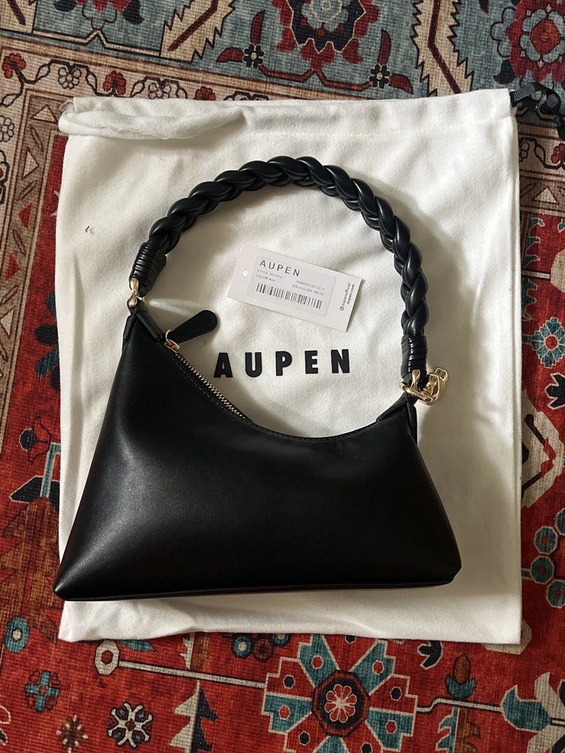AUPEN Black Leather Braided Handle Shoulder Bag (Category: Shoulder Bags) located in Tarlac. Submitted by 444_conservative (Listing ID 1459137025, Image 2). Description: - Brand: AUPEN - Color: Black - Material: Leather - Features: Braided top handle, zip closure - Includes: Original dust bag - Versatile: Ideal for everyday use or evening events.