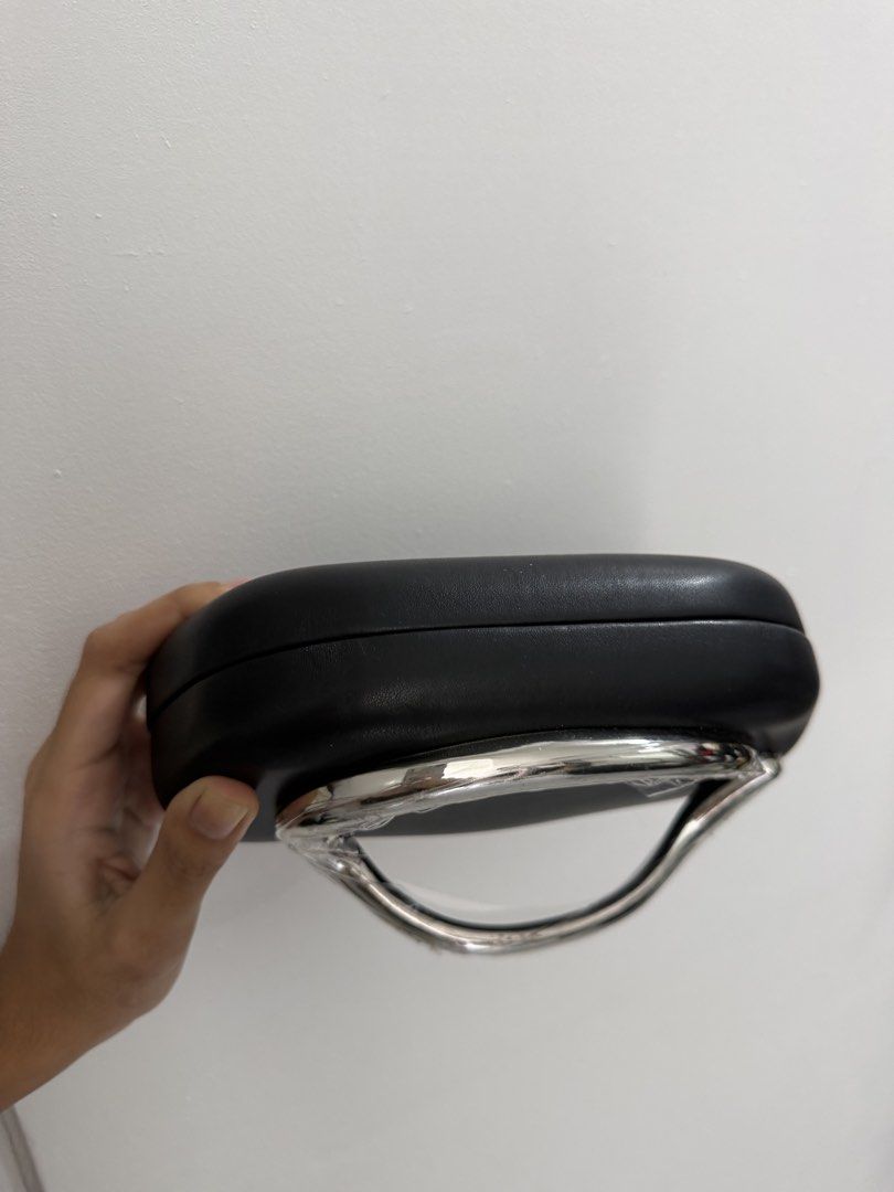 Black Clutch Bag with Silver Handle (Category: Clutches) located in Pasig City. Submitted by miss_abuelita (Listing ID 1459150385, Image 3). Description: - Elegant black clutch bag - Features a shiny silver handle, still protected by plastic wrap - Includes a detachable silver chain strap for versatile carrying - Ideal for evening events and special occasions.