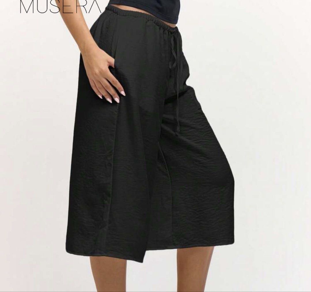 Black Culottes Wide Leg Pants Drawstring Waist (Category: Other Bottoms) located in Makati City. Submitted by _fitz (Listing ID 1459215612, Image 2). Description: - Wide-leg black culottes - Adjustable drawstring waist - Convenient side pockets - Unique crinkled fabric texture - Ideal for casual wear and lounging - never worn!! - too long for my liking.