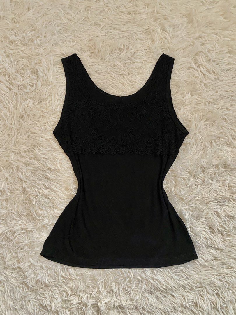 Black Lace Trim Tank Top (Category: Sleeveless) located in Guagua. Submitted by zenn_vi (Listing ID 1459257779, Image 1). Description: - Cute black tank top - Features pretty lace detail across the chest - Sleeveless design, ideal for layering or wearing on its own - Made from soft fabric for comfort - Fits well.