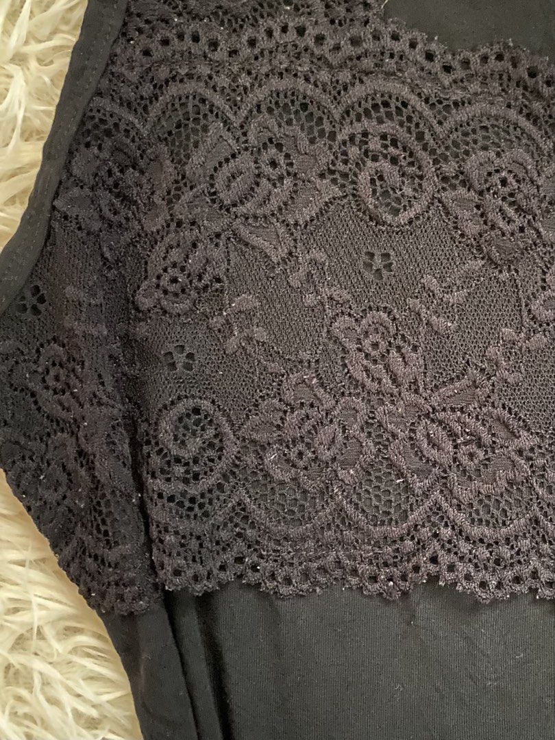 Black Lace Trim Tank Top (Category: Sleeveless) located in Guagua. Submitted by zenn_vi (Listing ID 1459257779, Image 2). Description: - Cute black tank top - Features pretty lace detail across the chest - Sleeveless design, ideal for layering or wearing on its own - Made from soft fabric for comfort - Fits well.