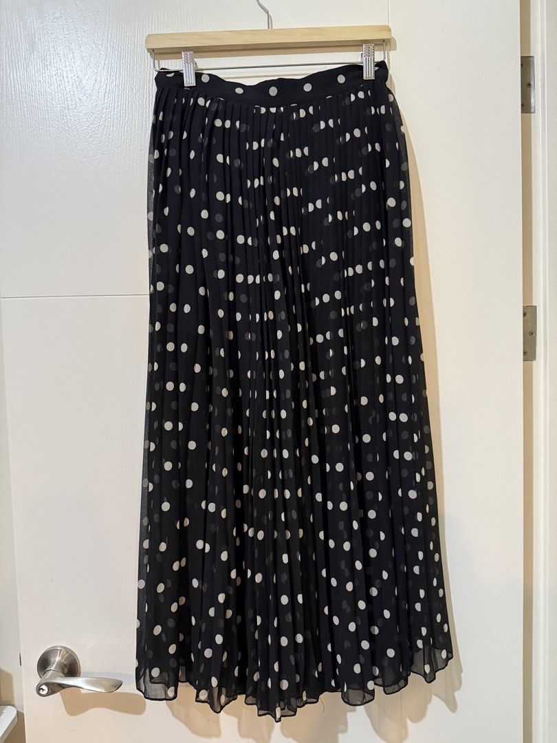 Black Polka Dot Pleated Midi Skirt (Category: Skirts) located in Manila. Submitted by shopdancedhanice (Listing ID 1459269278, Image 1). Description: - Black midi skirt with classic white polka dots - Elegant all-over pleating for a flattering silhouette - Made from lightweight fabric for comfortable wear - Perfect for dressing up or down, pairs beautifully with simple tops Note: Brand new from Mango but zipper is broken.