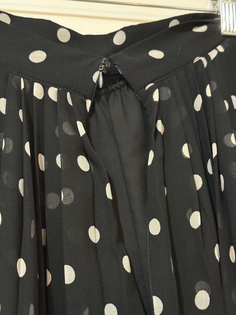 Black Polka Dot Pleated Midi Skirt (Category: Skirts) located in Manila. Submitted by shopdancedhanice (Listing ID 1459269278, Image 3). Description: - Black midi skirt with classic white polka dots - Elegant all-over pleating for a flattering silhouette - Made from lightweight fabric for comfortable wear - Perfect for dressing up or down, pairs beautifully with simple tops Note: Brand new from Mango but zipper is broken.