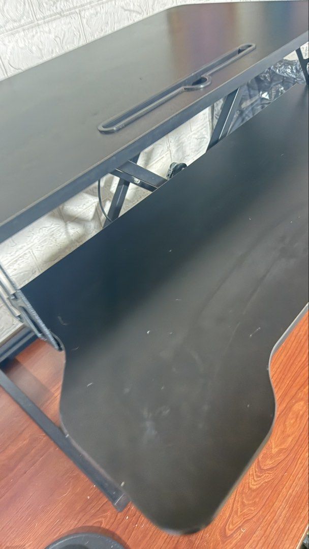 Black Standing Desk Converter - Sit Stand Desk Riser (Category: Tables & Sets) located in Quezon City. Submitted by ___ma.ria (Listing ID 1459287389, Image 3). Description: Refer to the Product Description as attached. Bought in orange app. No flaws and working fine, will send videos if needed. RFS: Declutter.