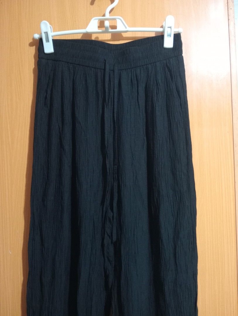 Black Textured Wide Leg Pants with Drawstring Waist (Category: Other Bottoms) located in Quezon City. Submitted by niceoutfits (Listing ID 1459114740, Image 3). Description: - Black wide-leg pants - Crinkled texture - Waist :26-32 - Length : 42 inches - Elastic waistband with drawstring tie - Size XL - Comfortable and casual - Ideal for everyday wear.