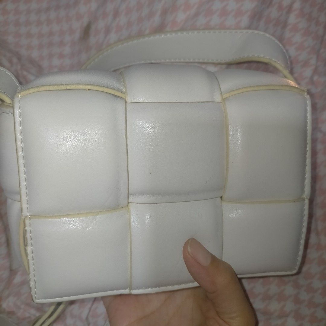Bottega VenetaPadded cassette bag (Category: Luxury Bags & Wallets) located in Manila. Submitted by agenttin (Listing ID 1426019469, Image 1). Description: The product shown is a Bottega Veneta Padded Cassette bag, featuring the brand's iconic Intrecciato woven design in luxurious nappa leather with a triangle buckle. .