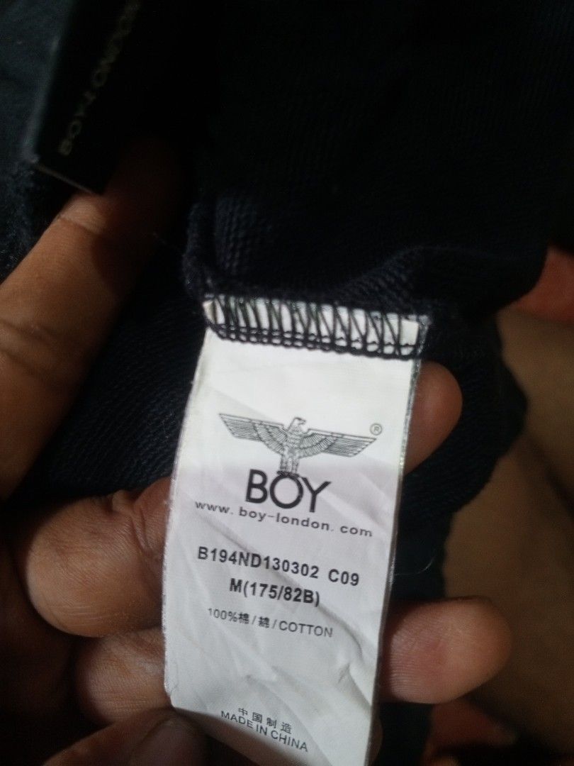 BOY London Black Sweatpants Size M (Category: Joggers) located in Caloocan City. Submitted by adrian011 (Listing ID 1459280380, Image 3). Description: - Brand: BOY London - Color: Black - Size: M (175/82B) - Features: Iconic eagle logo on right pocket, "LOVE THE BOY ALONE" graphic on back - Material: 100% Cotton - Style: Comfortable and stylish for everyday wear.