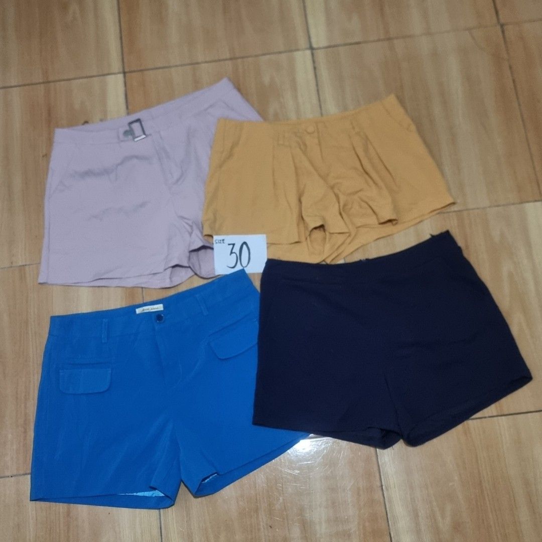 Bundle of 4 Shorts - Various Colors (Category: Shorts) located in Diffun. Submitted by declutteredbyJill (Listing ID 1459104955, Image 1). Description: - Four pairs of shorts included. - Colors: Mustard yellow, navy blue, royal blue, and light pink. - Features: Some shorts have pockets and button details. - Style: Ideal for casual wear. - Offer: Bundle deal for all four pairs. -Size 30.
