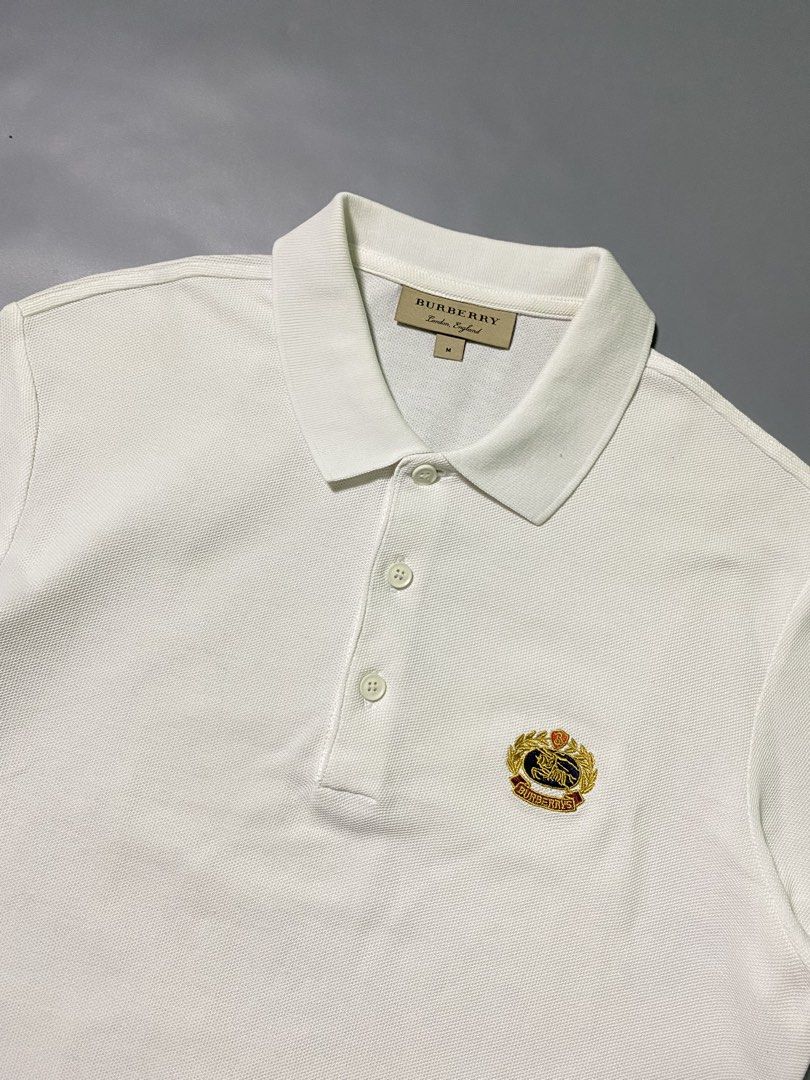 Burberry White Plain Logo Polo Shirt (Category: Luxury Apparel) located in Las Pinas. Submitted by reluxearchive (Listing ID 1459267422, Image 2). Description: Burberry White Plain Logo Polo Shirt Measurements ( Inches ) Width : 20 Length : 27 Condition : 10/10 Color Rate : 10/10 Flaws / Issues : None Price : 2000 📍100 % Authentic 📍What you see is what you get 🚚 Lbc | J&t | Lalamove | Dhl.