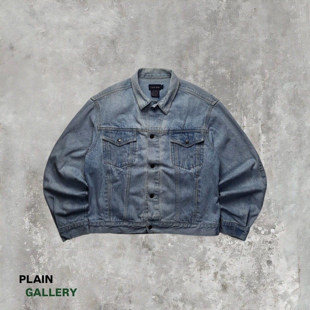 Calvin Klein Light Wash Denim Jacket Size L (Category: Coats, Jackets and Outerwear) located in Cebu City. Submitted by plain.gallery (Listing ID 1459231030, Image 1). Description: Washed Denim Jacket (CK) Size: Large - XLarge (super boxy fit) 👇Dimention (in inches)👇 Width: 25 Length: 24.5 Color rate: 9.8 Condition: 9.8 Issues: none.