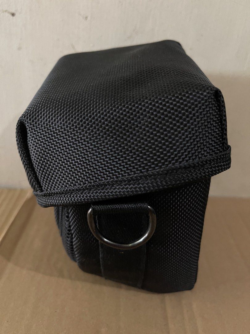Canon Black Camera Bag with Strap (Category: Camera Bags & Carriers) located in Quezon City. Submitted by akismurabels (Listing ID 1459093460, Image 2). Description: PRELOVED CANON CAMERA BAG NO COD WITH STRAP MOP: Gcash MOD:Lalamove Payment first before shipping. SF shouldered of the buyer. - Black Canon camera bag - Main compartment and front pocket - Detachable and adjustable shoulder strap - Buckle closure on front flap - D-rings on sides for