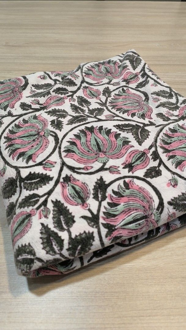 CARILOO round Indian block print tablecloth (Category: Skirts) located in Makati City. Submitted by fashion_thrift_ (Listing ID 1459287184, Image 1). Description: Beautiful CARILOO fabric with a lovely floral print. Features pink, green, and black flowers on a white background. Great for sewing projects, crafts, or home decor. The material feels soft and lightweight. Plenty of fabric here for your creative ideas..