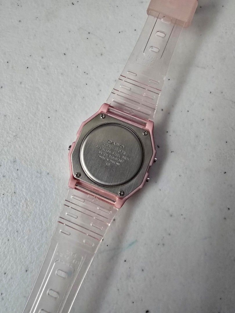 Casio F-91W Pink Digital Watch (Category: Women's Watches) located in Quezon City. Submitted by mariescloset2020 (Listing ID 1459285589, Image 2). Description: - Classic Casio F-91W digital watch - Trendy pink casing - Clear, transparent strap - Displays time and date - Built-in stopwatch function - Water resistant - Perfect retro accessory for everyday style.