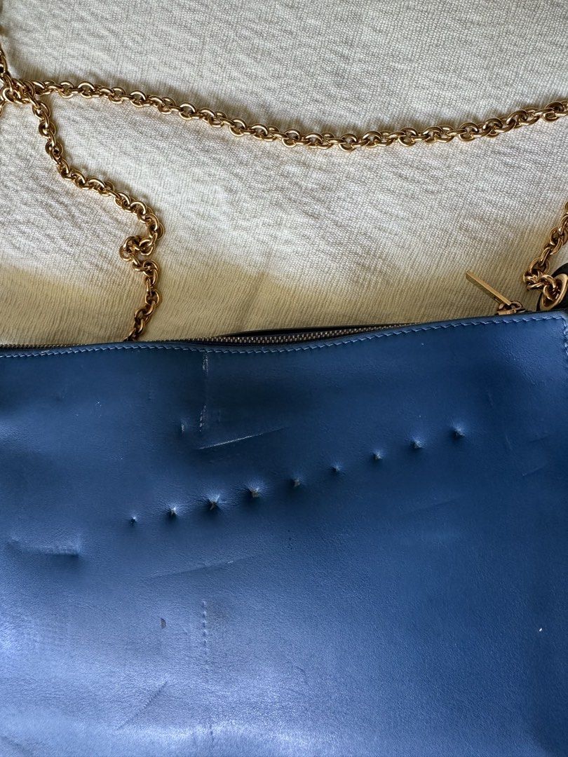 Celine Pocket Envelope Leather Chain Pouch (Category: Cross-body Bags) located in Lipa City. Submitted by bagabonds (Listing ID 1459106227, Image 2). Description: - The chain marked the body, see photos for reference - NGA but cross referencing online it feels like its authentic - with code inside Can send more photos :) .