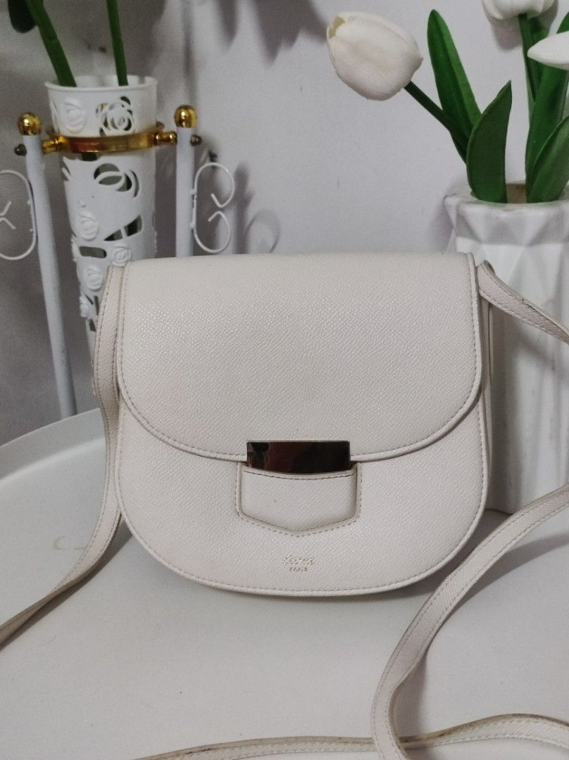 Celine Sling Bag (Category: Luxury Bags & Wallets) located in Santa Rosa. Submitted by sassycollection. (Listing ID 1459091232, Image 2). Description: The Trotteur Crossbody Bag features a leather body, a back exterior slip pocket, an adjustable flat leather strap, a front flap with a slip on closure, and an interior slip pocket. Smooth, elegant lines make the Celine Trotteur bag a joy to look at and to wear. Despite its simple silhouette, the Tr