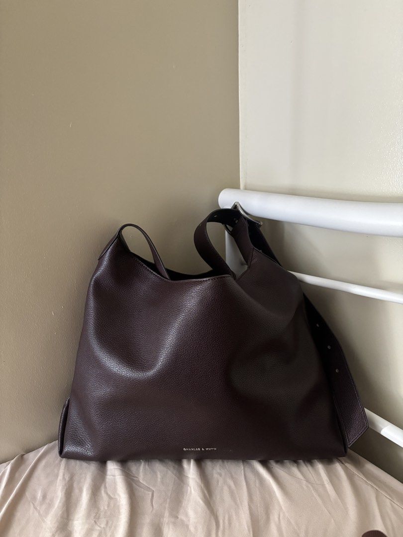 Charles & Keith hobo Shoulder Bag (Category: Shoulder Bags) located in Malabon City. Submitted by jesabibi (Listing ID 1459155092, Image 2). Description: - Brand: Charles & Keith - shade: plum - Material: Pebbled Leather - Features: Spacious interior, adjustable strap with buckle detail - bought in Japan last Oct. 2025 Negotiable.