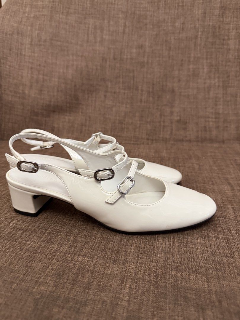 Charles & Keith White Mary Jane Slingback Pumps (Category: Heels) located in Tarlac. Submitted by anotherastrid (Listing ID 1459237798, Image 2). Description: USED ONCE. SA WEDDING. TAMBAK EVER SINCE. - Brand: Charles & Keith - Style: White Mary Jane Slingback Pumps - Size: EU 37 (UK 4 / US 6) - Color: White - Features: Patent finish, adjustable slingback strap with buckle detail - Perfect for: Adding a chic and elegant touch to any outfit Negoti
