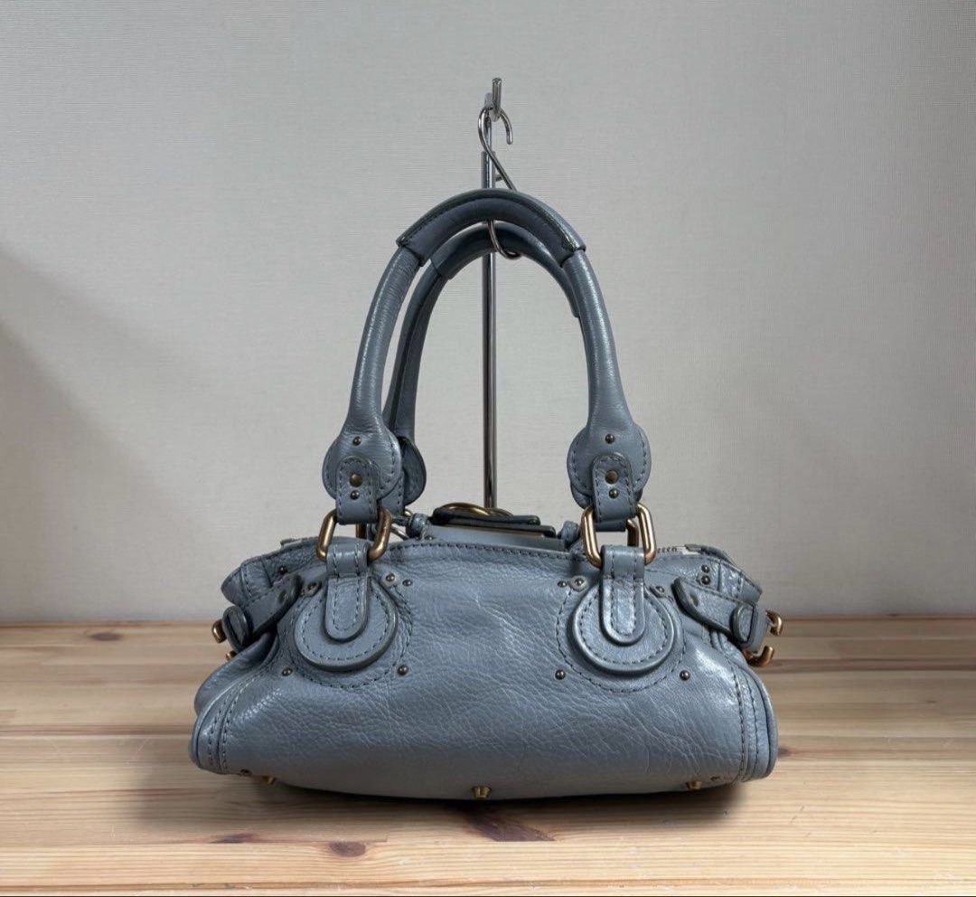 Chloe Paddington Mini Handbag Gray Leather (Category: Shoulder Bags) located in Las Pinas. Submitted by daisuki_japan_luxury_by_reiko (Listing ID 1459101028, Image 2). Description: ○ Product Description Good condition Chloe Padlock Small Paddington Handbag, shoulder carry ok Leather material ○ Color Gray ○ Accessories Padlock, key ○ Measurements (slight errors may occur) 27 x 14 x 14 cm Total height including handle: 31 cm ○ Condition Slight scuf