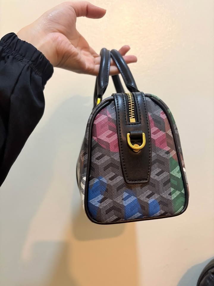 Christy Ng Enzo In Multi (Category: Shoulder Bags) located in Manila. Submitted by chai.inc (Listing ID 1459188268, Image 2). Description: - Christy Ng Enzo - Vibrant colorful geometric pattern - Detachable shoulder strap included - Elegant gold hardware details - Comes with a dust bag - Ideal for everyday use Pasay Location.