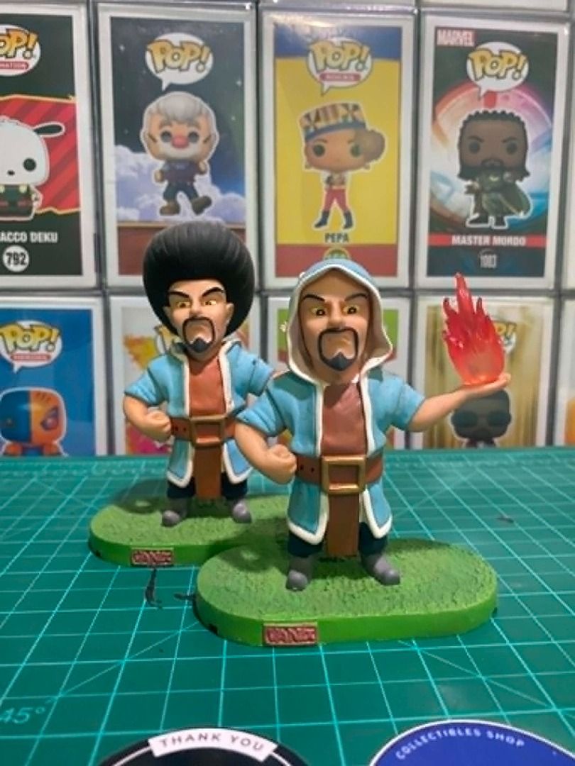 Clash of Clans Wizard Figures Set (Category: Figurines & Statues) located in Angeles City. Submitted by rickki_t (Listing ID 1459106710, Image 1). Description: - Set of 2 Clash of Clans Wizard figures - Each figure stands on a green base with 'GAME' inscribed - One wizard is depicted holding a fireball - Ideal collectible item for any Clash of Clans fan - Items are not authentic but copies/knockoffs.