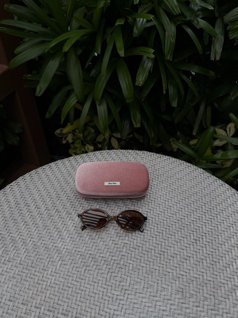 Classic Miu Miu Tortoise Shell Sunglasses with Case (Category: Sunglasses & Eyewear) located in Manila. Submitted by urbanglasses.mnl (Listing ID 1459244715, Image 1). Description: - Sourced from: 🇻🇳 - Model: SMU 04Z - Chic Tortoiseshell Pattern Frames - Includes the Miu Miu Pink Velvet Case - A versatile accessory to elevate any outfit.