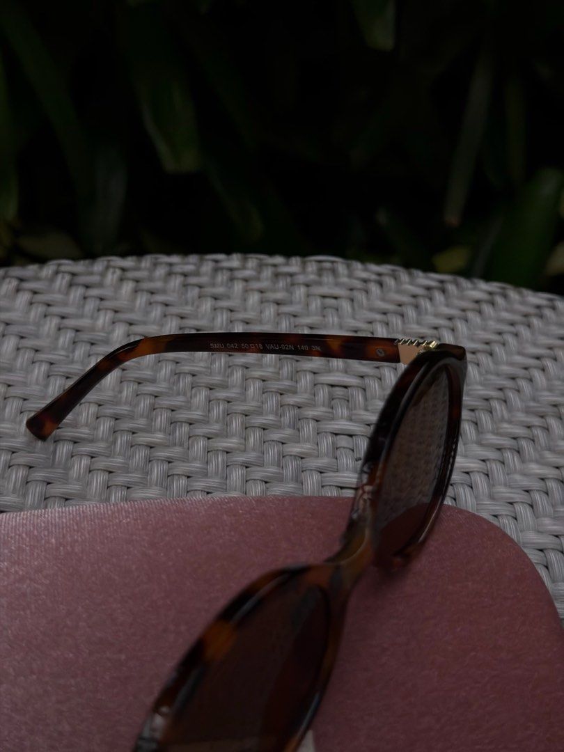 Classic Miu Miu Tortoise Shell Sunglasses with Case (Category: Sunglasses & Eyewear) located in Manila. Submitted by urbanglasses.mnl (Listing ID 1459244715, Image 3). Description: - Sourced from: 🇻🇳 - Model: SMU 04Z - Chic Tortoiseshell Pattern Frames - Includes the Miu Miu Pink Velvet Case - A versatile accessory to elevate any outfit.