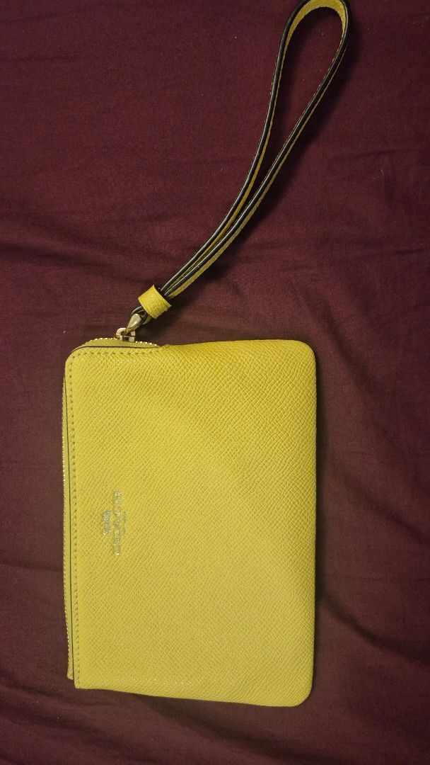 Coach Corner Zip Wristlet in Retro Yellow (Category: Luxury Bags & Wallets) located in Manila. Submitted by spottedleafy102 (Listing ID 1459204001, Image 1). Description: - Original price CAD78 or PHP3,504 - Authentic Coach yellow leather wristlet.