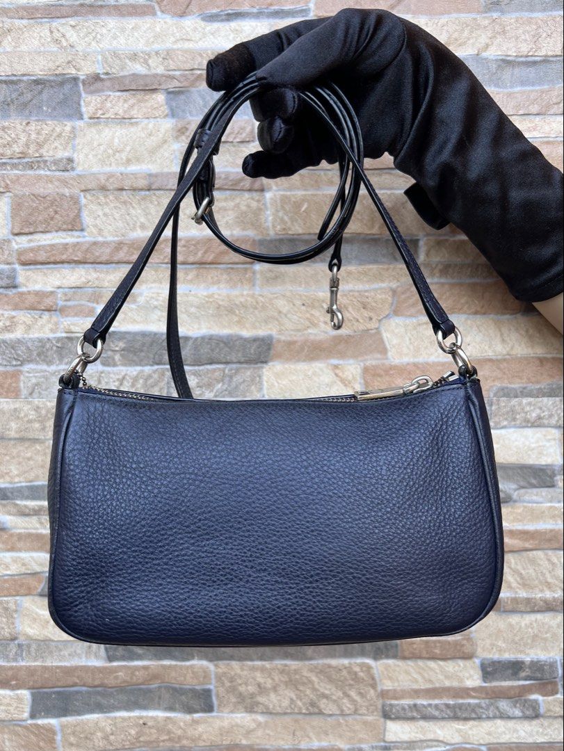 Coach Messico Top Handle Pouch (F36645) (Category: Luxury Bags & Wallets) located in Cavite. Submitted by justbrowsing_decluttering (Listing ID 1459175574, Image 3). Description: Shoulder Bag | Cross-body 1 Full pocket Inside Color: Dark Blue (almost like black) with Silver Tone Hardware (Faded Gold) Size: Small Dimensions: 8 3/4” Length, 5” Height, 3” Width Material: Genuine Pebbled Leather -The white style number tag were removed -Signs of use 