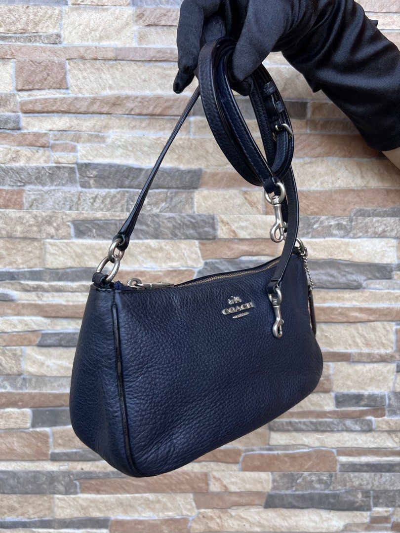 Coach Messico Top Handle Pouch (F36645) (Category: Luxury Bags & Wallets) located in Cavite. Submitted by justbrowsing_decluttering (Listing ID 1459175574, Image 2). Description: Shoulder Bag | Cross-body 1 Full pocket Inside Color: Dark Blue (almost like black) with Silver Tone Hardware (Faded Gold) Size: Small Dimensions: 8 3/4” Length, 5” Height, 3” Width Material: Genuine Pebbled Leather -The white style number tag were removed -Signs of use 