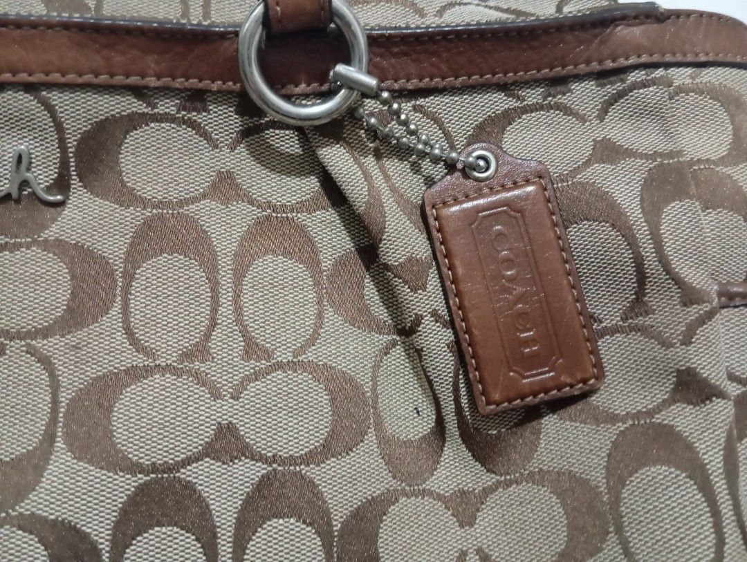 Coach Monogram Canvas Leather Trim Tote Bag (Category: Luxury Bags & Wallets) located in Manila. Submitted by jzk25 (Listing ID 1459090715, Image 3). Description: - Classic Coach monogram tote bag - Color: Brown canvas with leather trim and handles - Features: Exterior slip pockets, interior zippered pocket - Iconic "C" monogram pattern - Perfect size for everyday use - Authenticity tag included missing lngnyung sling nya .