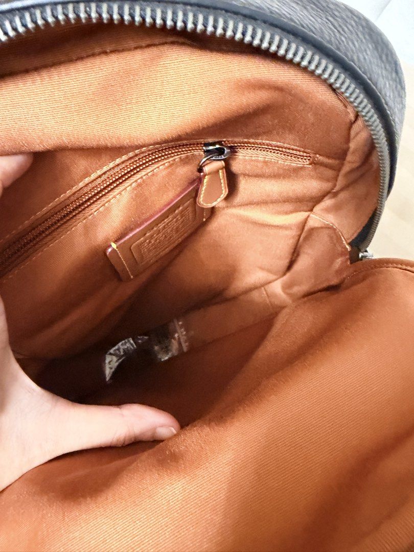 Coach Signature Sling Bag (Category: Luxury Bags & Wallets) located in Imus. Submitted by cristinaRC (Listing ID 1459214694, Image 3). Description: - Coach sling bag in signature print - Color: Black and Tan - Front zip pocket for quick access - Main compartment with interior zip pocket for organization - Adjustable strap for comfortable wear - Includes original tags - Ideal for everyday use Brandnew with tag From USA Hindi pa nagagamit Shipping 