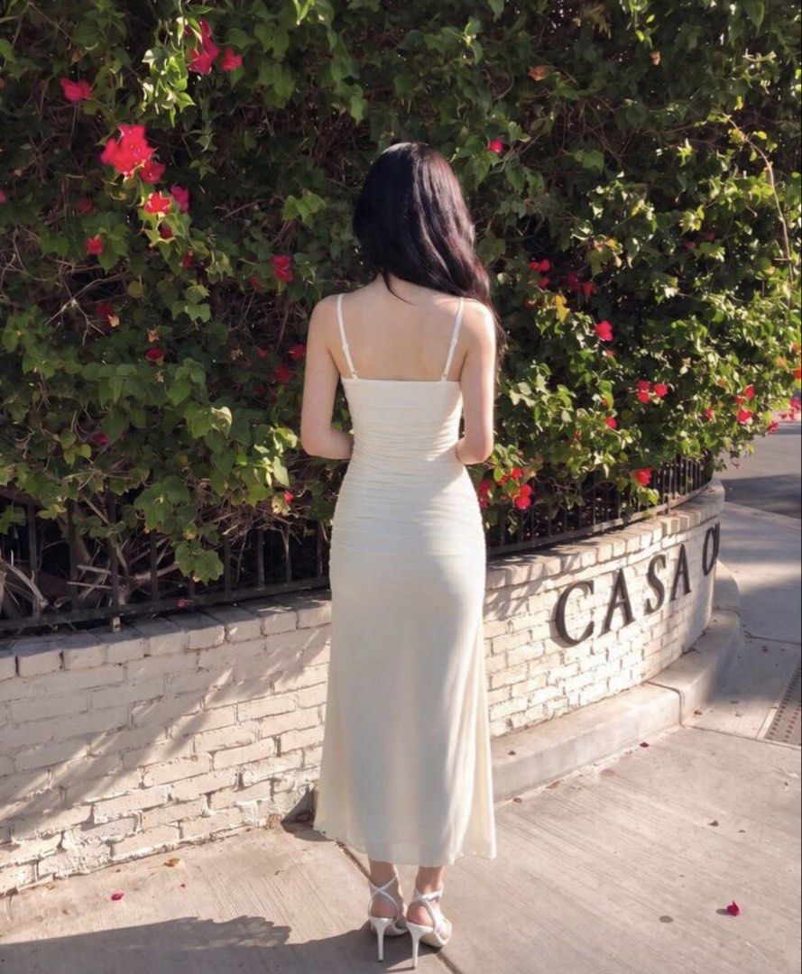 Cream Halter Neck Ruched Midi Dress (Category: Dresses) located in Quezon City. Submitted by cozykath (Listing ID 1459258404, Image 2). Description: - Cream halter neck midi dress - Features a ruched bodice - Flowy skirt - Spaghetti straps - Ideal for summer events or a night out - Comfortable and chic.