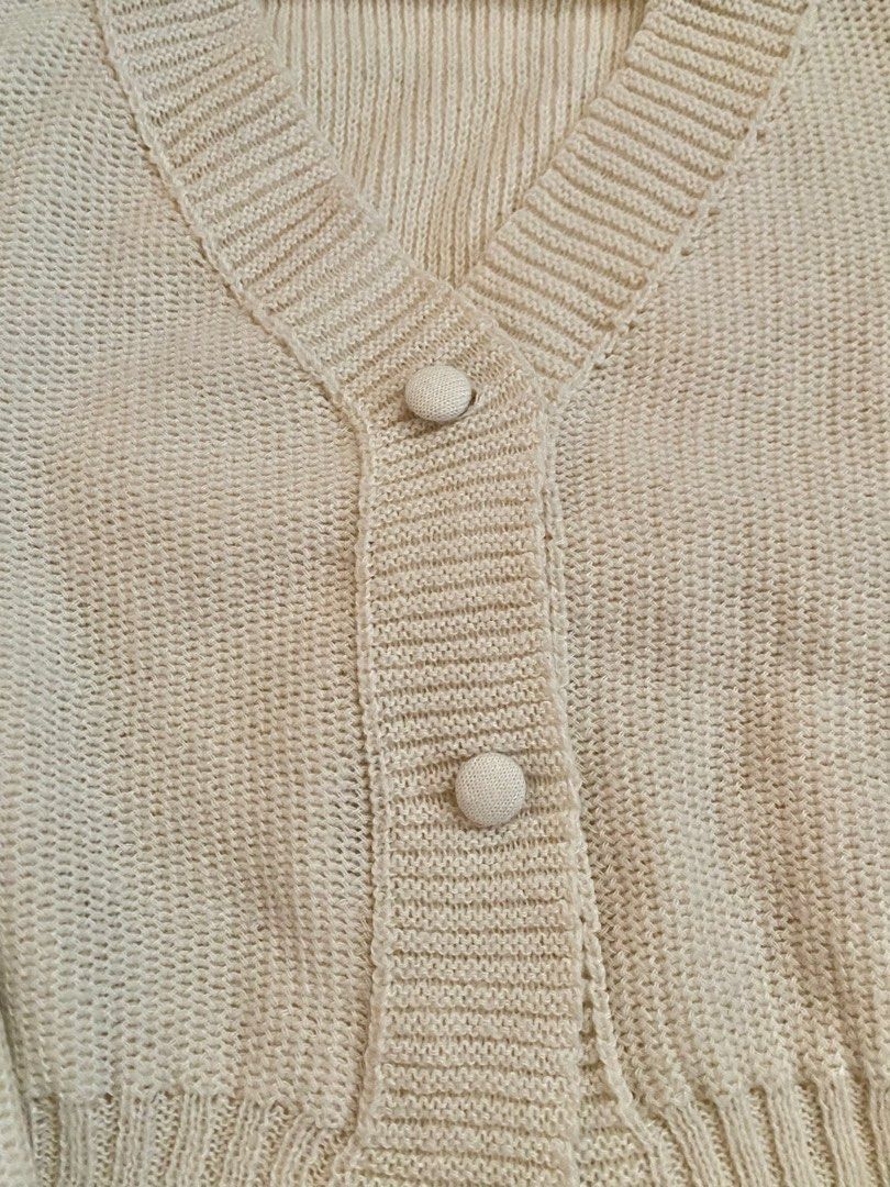 Cream Knit Cropped Cardigan with Button Front (Category: Coats, Jackets and Outerwear) located in Guagua. Submitted by zenn_vi (Listing ID 1459256685, Image 2). Description: - Cream knit cardigan - Cropped length - Balloon sleeves - V-neck - Button front closure - Ribbed cuffs and hem - Super cozy and cute - Great for layering.
